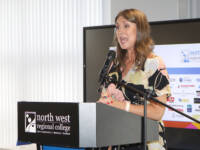 Woman speaking on stage