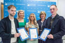 group of students holding certificates