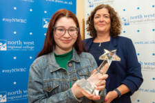 Two women with a trophy
