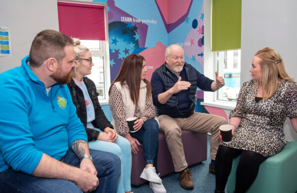 Group of mature community  learners talking together