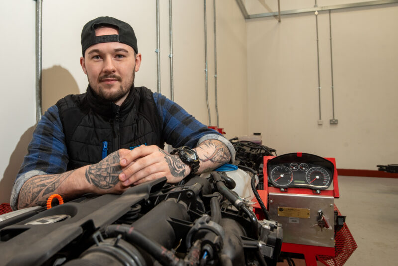 Man pictured in motor vehicle garage