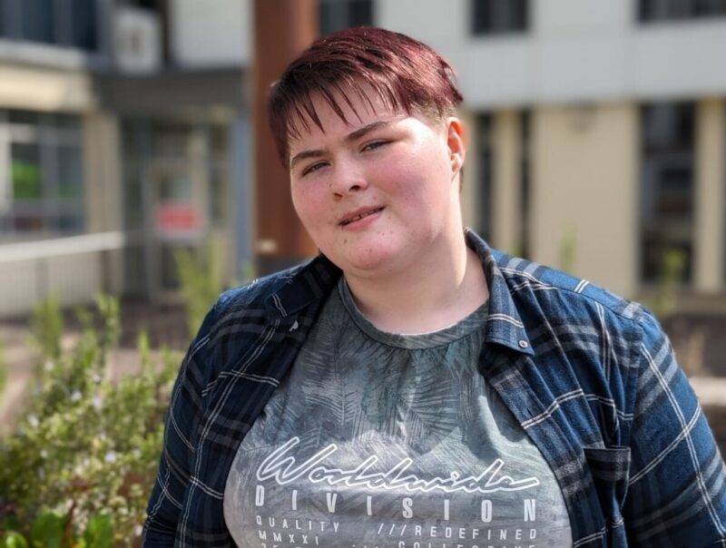 student pictured outside a college building
