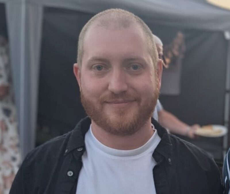 man with a beard smiling