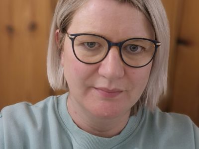 Picture of female lecturer at NWRC wearing glasses.