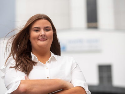 Katelyn McShane standing outside NWRC campus