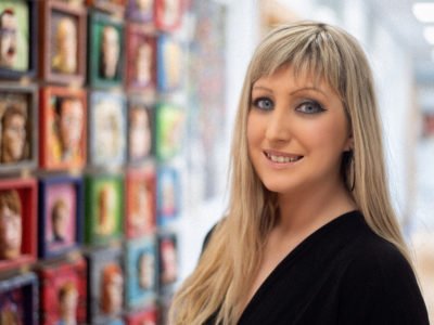 Female lecturer in the halls of the Art building at NWRC Limavady Campus