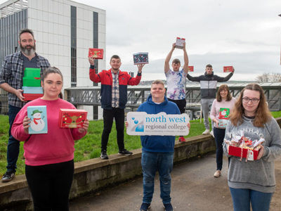 Group of NWRC students holding Christmas Eve boxes