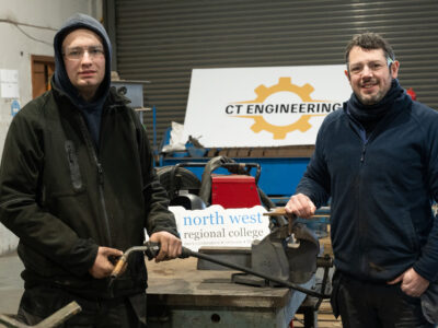Two male welders in a factory