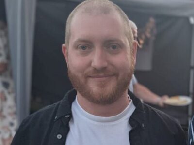 man with a beard smiling